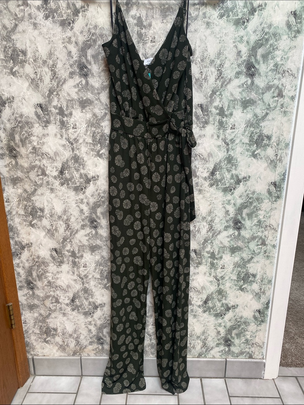 Kaileigh Black Sleeveless Wrap-Front Jumpsuit with Gray Leaf Print